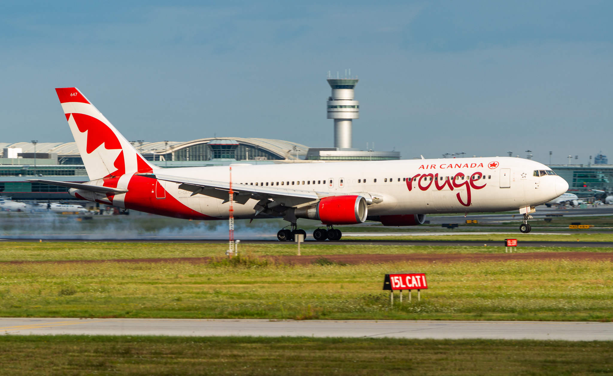 1 0 an air canada rouge b767-300er touching down on rwy 23