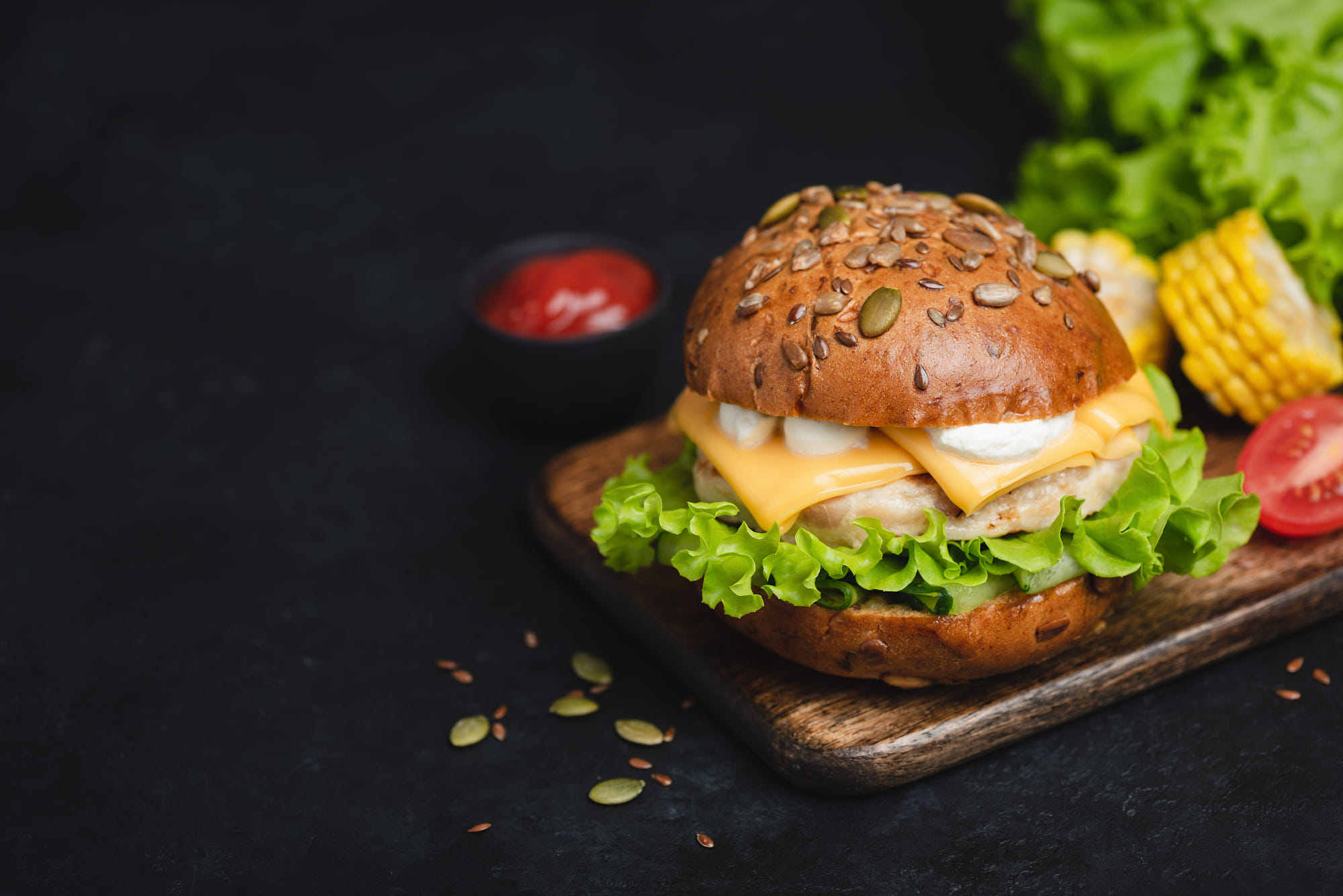 classic cheeseburger on dark background